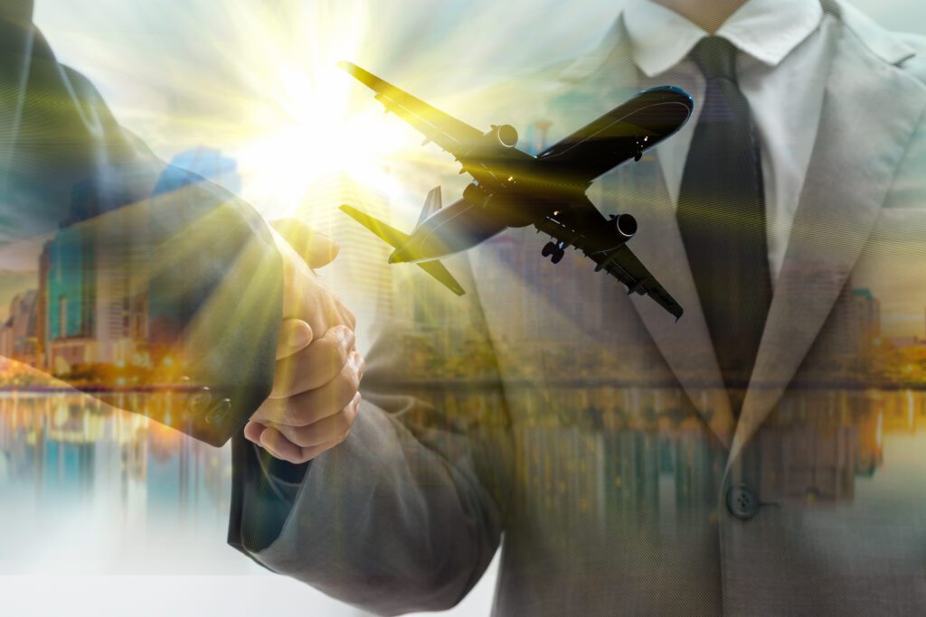 Double exposure of business handshake and airplane in sunrise of city family run taxi business